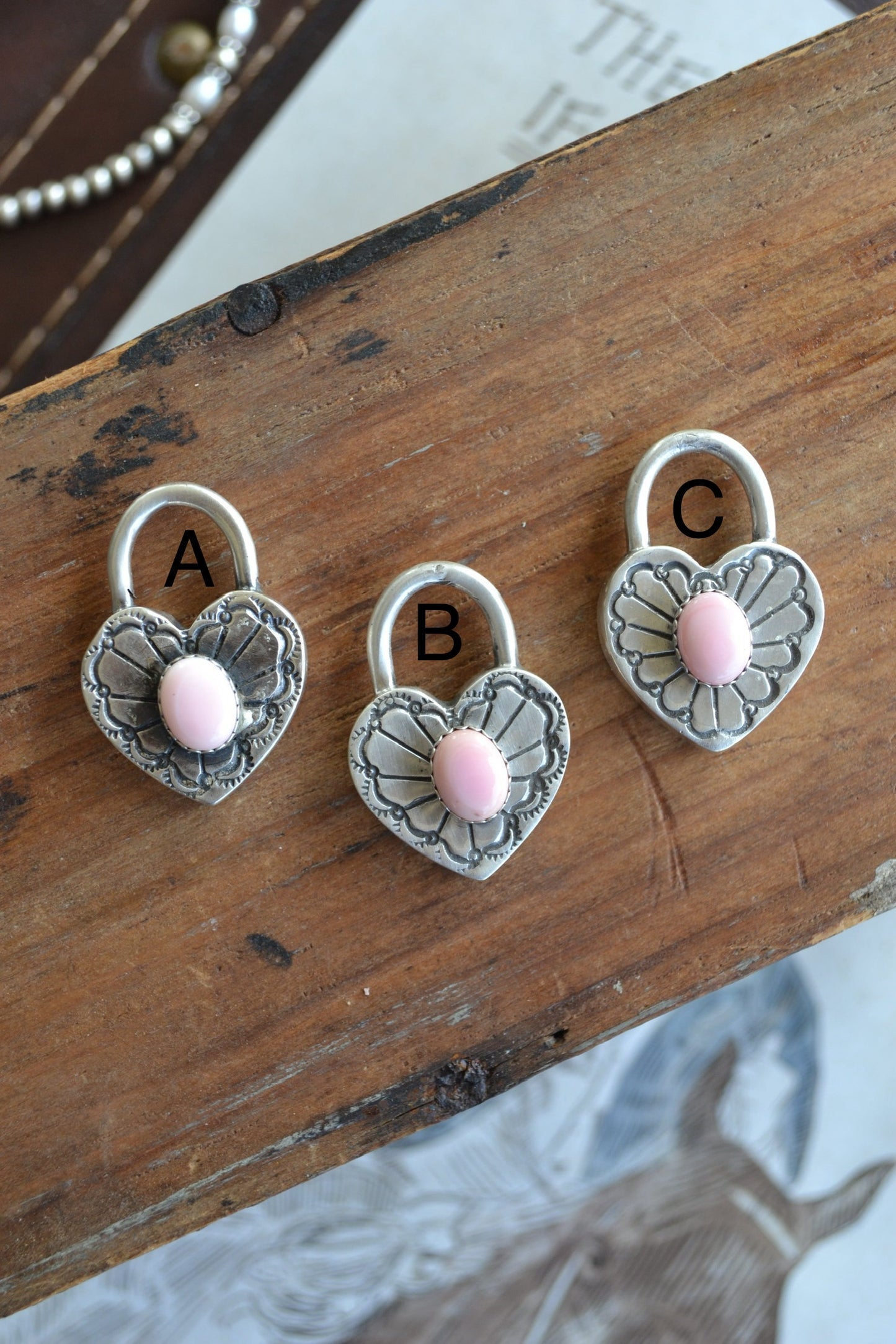 The Royce Pink Conch Heart Pendants