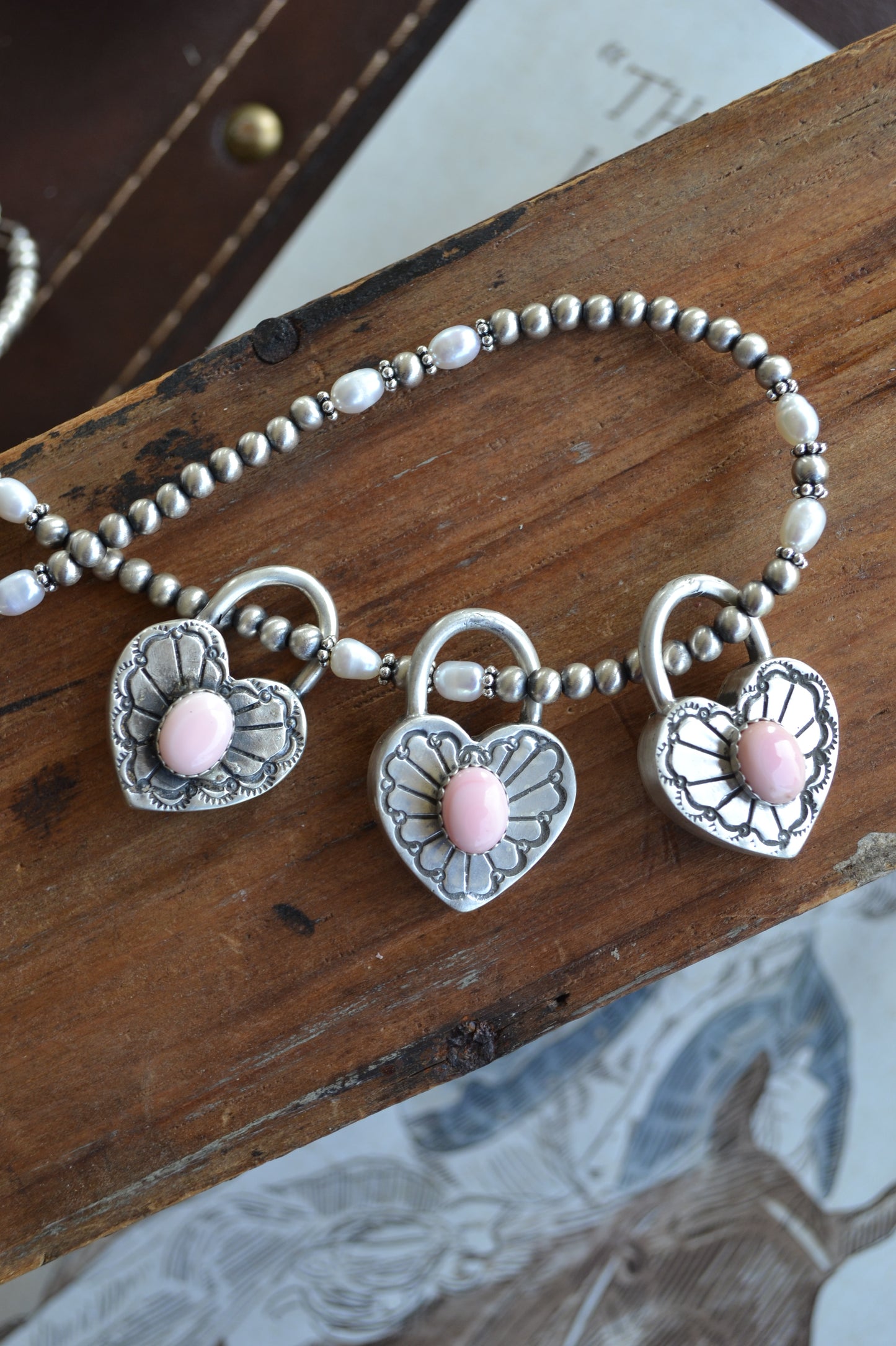 The Royce Pink Conch Heart Pendants