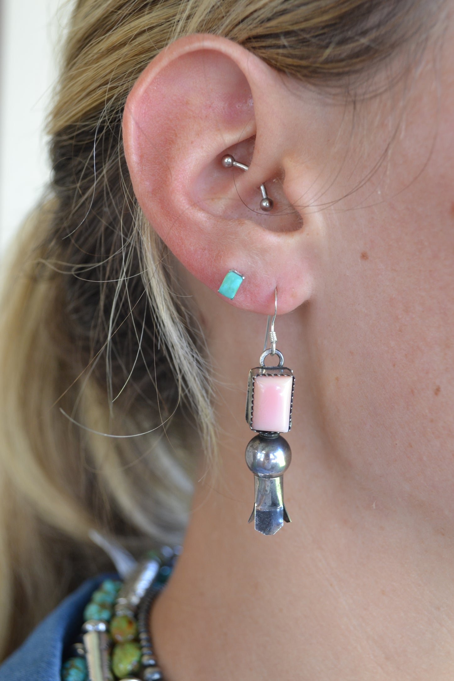 Tia Long pink conch earrings