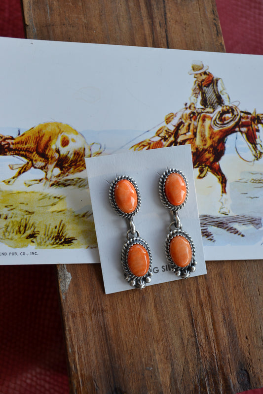 Native made orange spiny oyster dangle earrings 