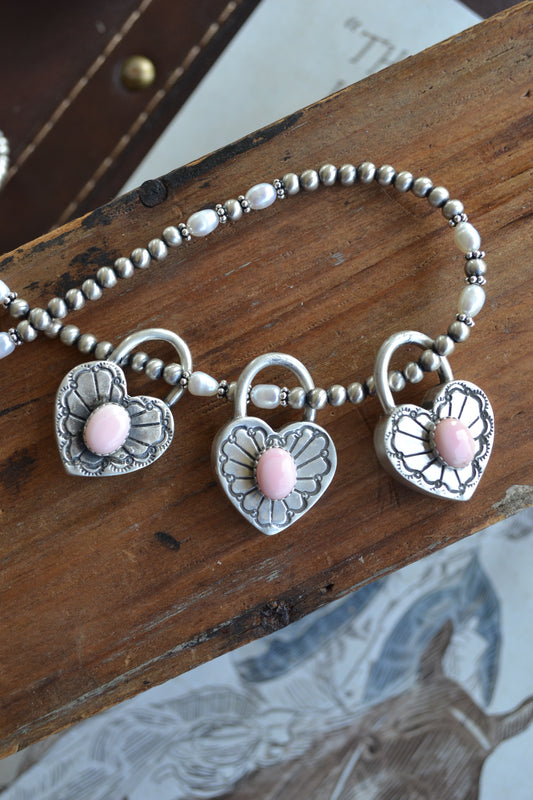The Royce Pink Conch Heart Pendants