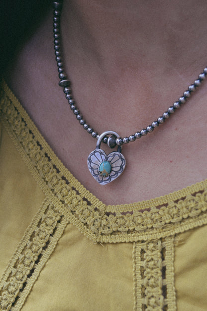 The Royce Pink Conch Heart Pendants